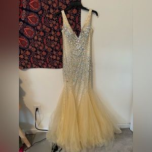 Dave and Johnny Prom Dress size 7/8 and is missing a few beads along the dress.